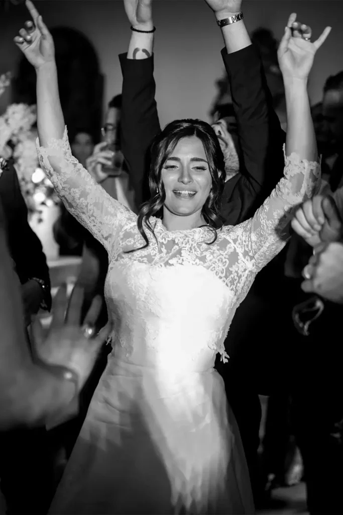 An emotional and joyful bride dancing at her wedding reception in Vigna Chinet, Turin. Capturing the essence of love with the best Italian wedding photography.