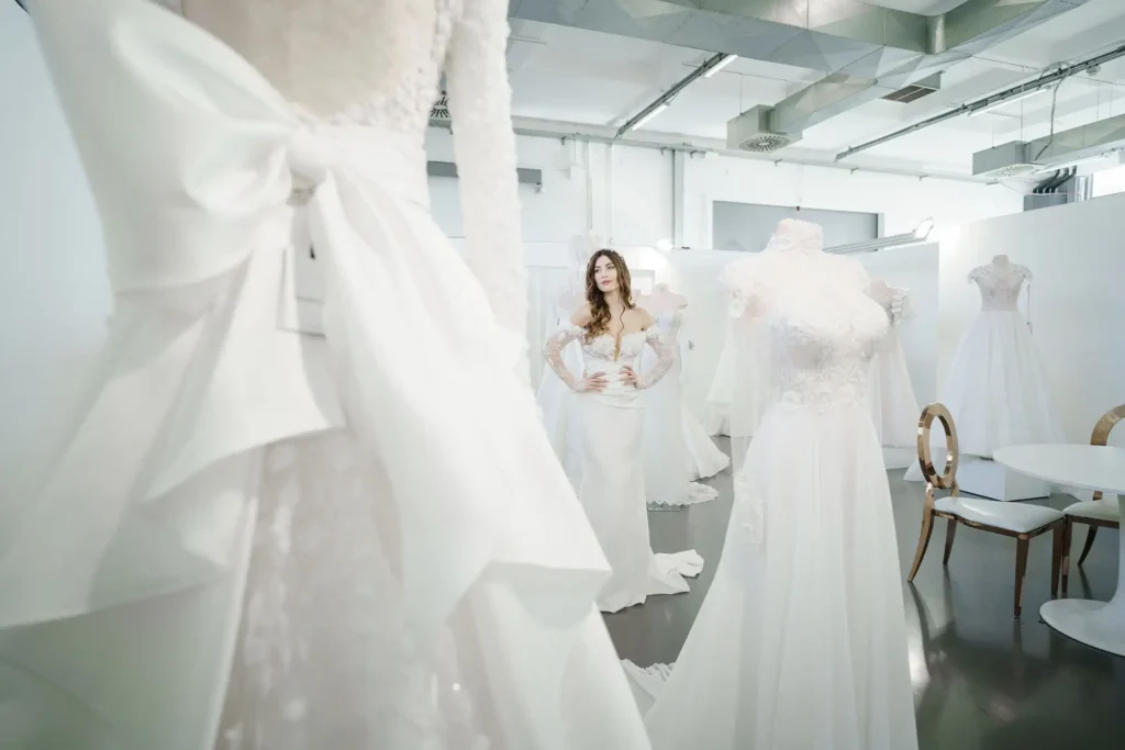 Explore wedding dresses in a Milan showroom, captured by Italy wedding photographer. Find your dream gown.