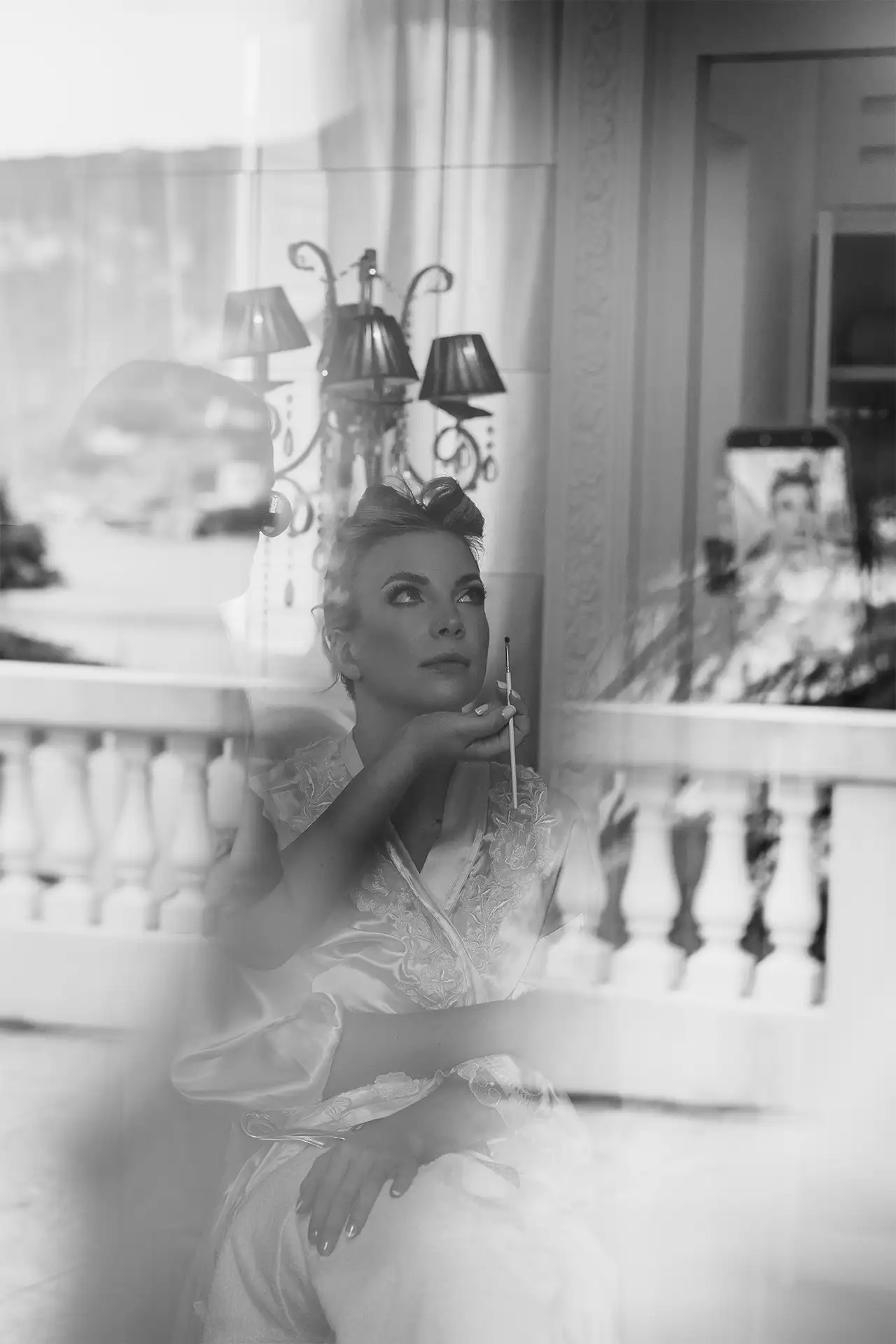 Bride getting ready in a robe before her Villa Giulia wedding on Lake Como