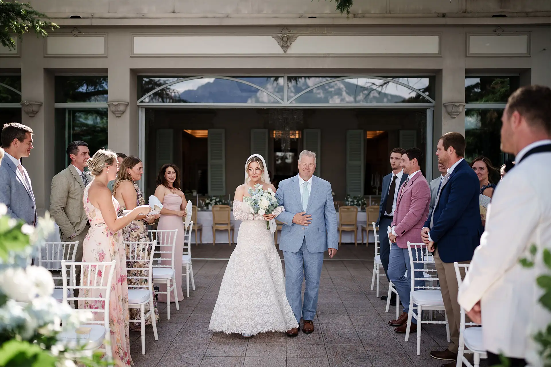Bride walking down the aisle with her father at Villa Giulia on Lake Como