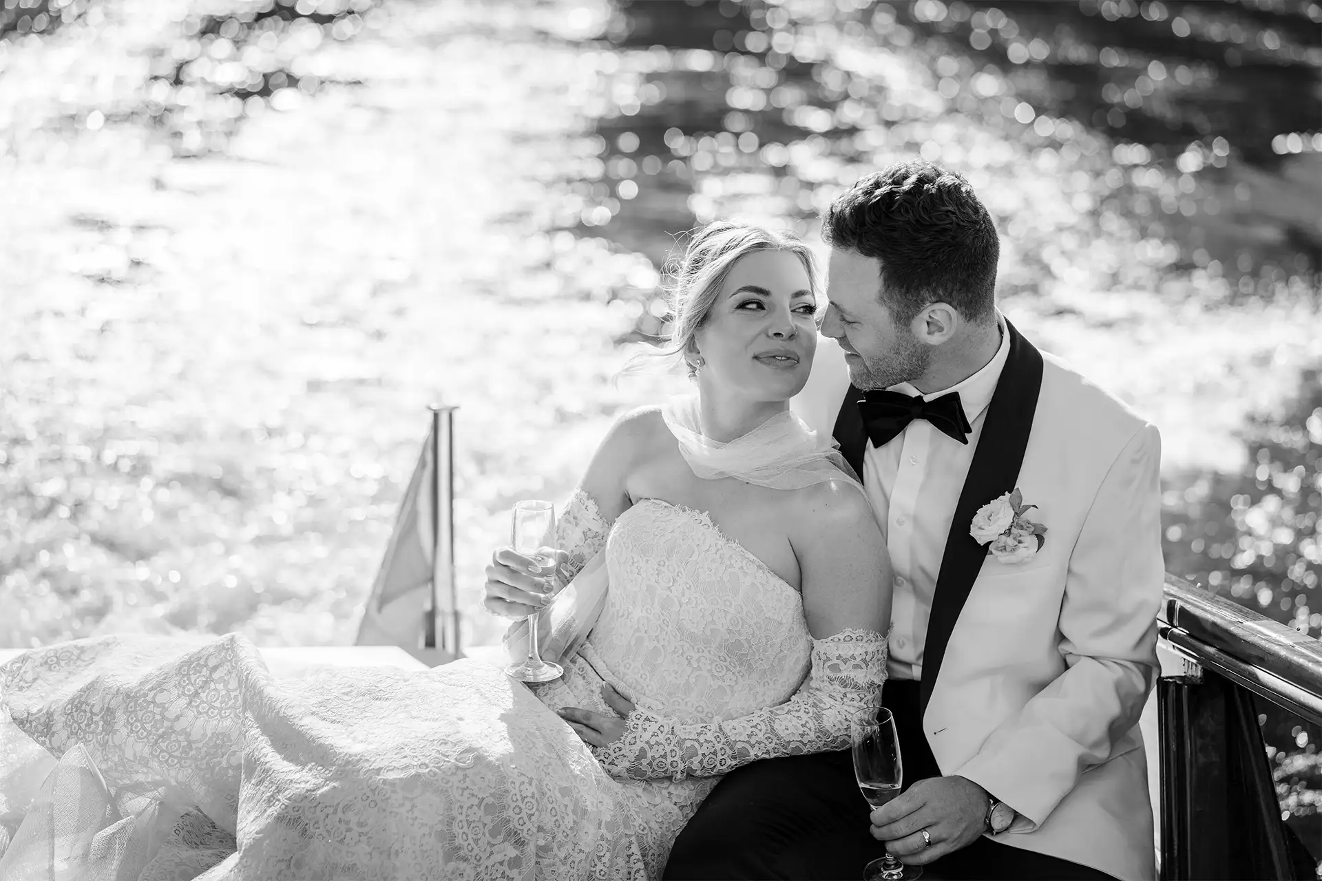 Black and white portrait of newlyweds on a boat on Lake Como