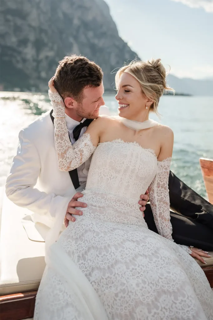 Bride and groom portrait on a wooden boat on Lake Como