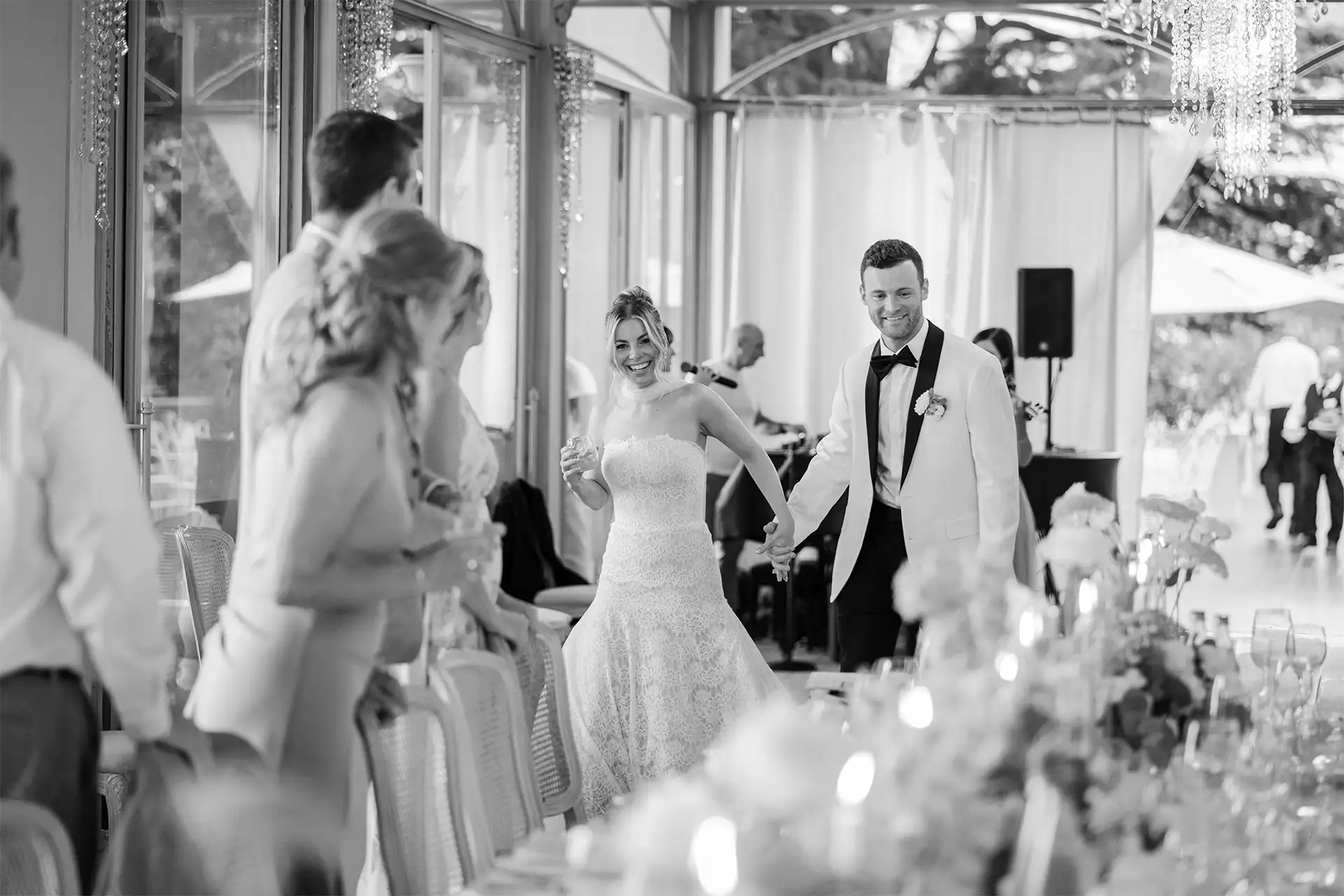 Bride and groom walking into their Villa Giulia wedding reception