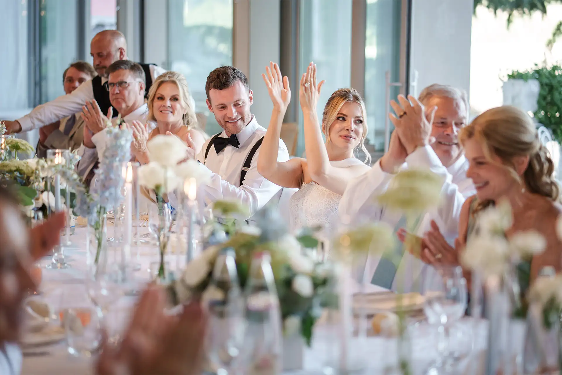 Bride and groom listening to a speech during their Villa Giulia wedding reception