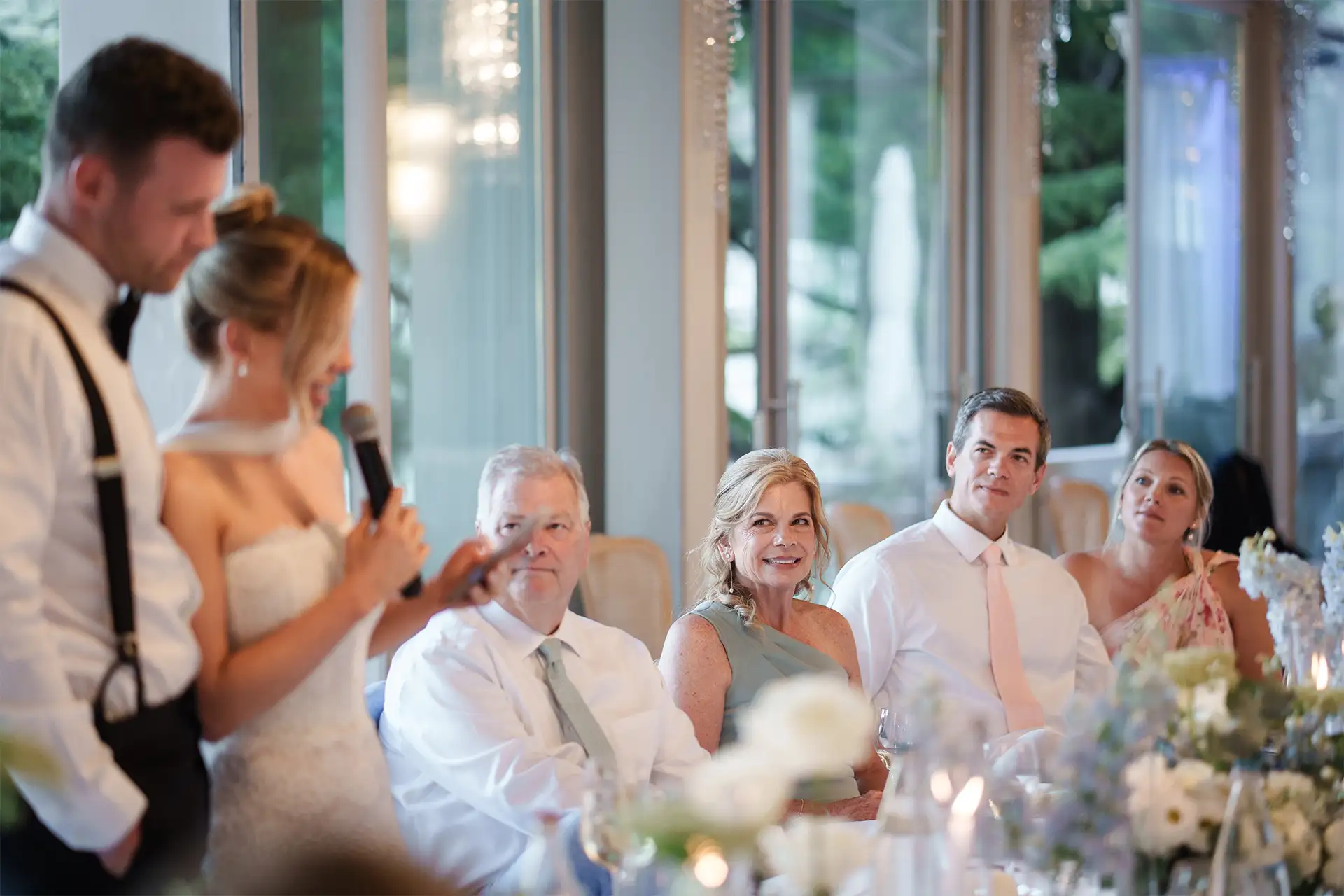 Wedding guests listening to a reception speech at Villa Giulia