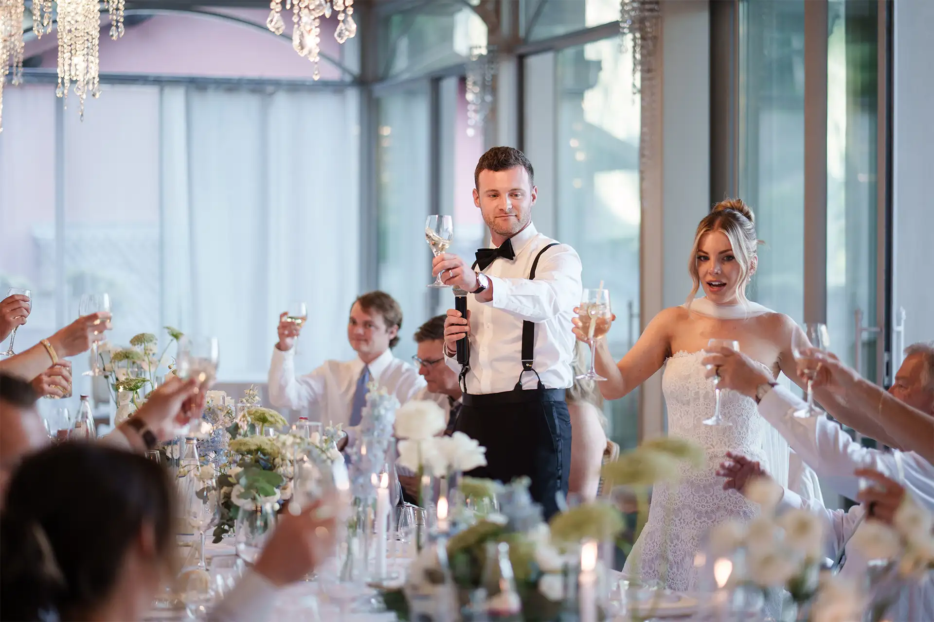 Bride and groom smiling during a wedding toast at Villa Giulia