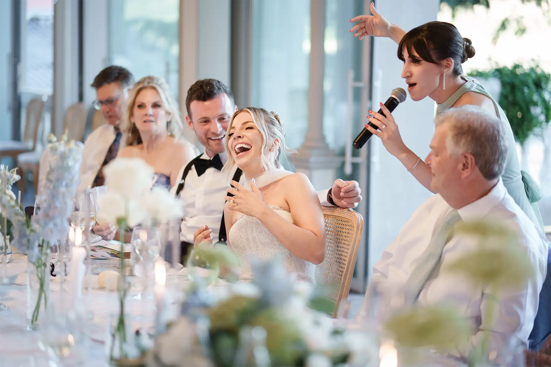 Bride and guests laughing during the Villa Giulia wedding reception